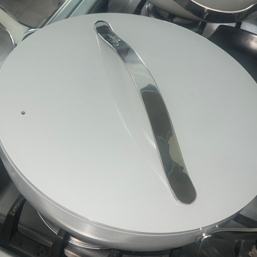 Sleek White Cookware with Silver Handle